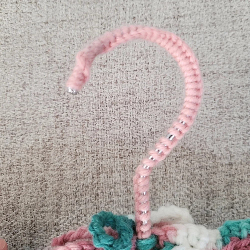 Vintage handmade knit clothing hanger